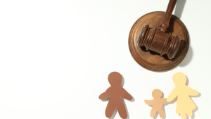 Gavel with paper cutout family, illustrating family law.