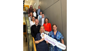 CKT staff holding Investors in Diversity Bronze award sign