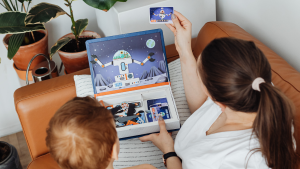 Mother showing child a spaceperson card